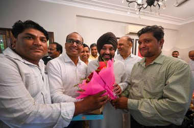 NEW DELHI INDIA AUGUST 31 2023 Congress leader Arvinder Singh Lovely gets congratulated by his supporters and other congress leaders after being appointed as the President of Delhi Pradesh Congress Committee at his residence in Kalindi Colony  clipart