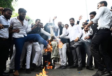 LUCKNOW INDIA AUGUST 30 2023 Advocates of Awadh Bar Association staged a protest against the police administration over the Hapur incident during the protest they block the road and burn an effigy of police administration on August 30 2023 in Lucknow clipart