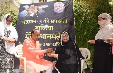  NEW DELHI INDIA AUGUST 30 2023 Muslim women tie Chandrayan Rakhi to former Union Minister and Vice Chairman Gandhi Smriti Vijay Goel celebration on the occasion of Raksha Bandhan at his Residence on August 30 2023 in New Delhi India Muslim women con clipart