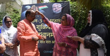  NEW DELHI INDIA AUGUST 30 2023 Muslim women tie Chandrayan Rakhi to former Union Minister and Vice Chairman Gandhi Smriti Vijay Goel celebration on the occasion of Raksha Bandhan at his Residence on August 30 2023 in New Delhi India Muslim women con clipart