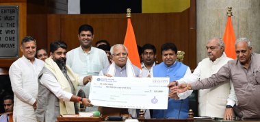 CHANDIGARH INDIA AUGUST 29 2023 Haryana CM Manohar Lal Khattar speaker Gain Chand Gupta Opposition leader Bhupinder Singh Hooda honring to BJP MLA Aseem Goyal best MLA award during Haryana Vidhan Sabha Monsoon session on August 29 2023 in Chandigarh  clipart