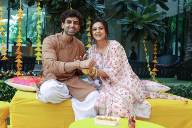 NEW DELHI INDIA, AUGUST 28 2023: Indian actors Ridhi Dogra and Akshay Dogra celebrate Raksha Bandhan during an exclusive interview with HT City for Rakhi festival special shoot on August 28 2023 in New Delhi India. clipart