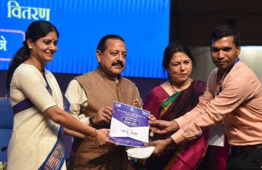 NEW DELHI INDIA AUGUST 28 2023 Union MoSs Jitendra Singh Meenakashi Lekhi and Anupriya Patel L distribute an appointment letter to a newly inducted recruit at Rozgar Mela at National Media Centre on August 28 2023 in New Delhi India Photo by Sonu Meh clipart