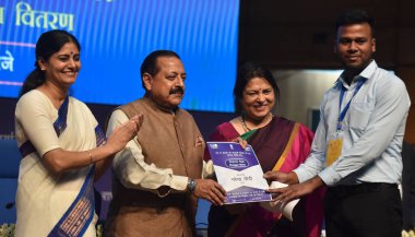 NEW DELHI INDIA AUGUST 28 2023 Union MoSs Jitendra Singh Meenakashi Lekhi and Anupriya Patel L distribute an appointment letter to a newly inducted recruit at Rozgar Mela at National Media Centre on August 28 2023 in New Delhi India Photo by Sonu Meh clipart