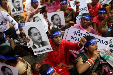 NEW DELHI INDIA AUGUST 28 2023 Safai Karmachari Andolan workers along with family members of the people who were killed in sewer and septic tanks stage a protest against Central government during Stop Killing Us campaign at Jantar Mantar on August 28 clipart