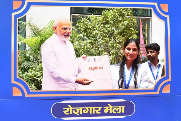 stock image NEW DELHI INDIA AUGUST 28 2023 Newly inducted recruits pose for photos with a cutout of PM Modi after receiving their appointment letters at Rozgar Mela at National Media Centre on August 28 2023 in New Delhi India Photo by Sonu Mehta Hindustan Times