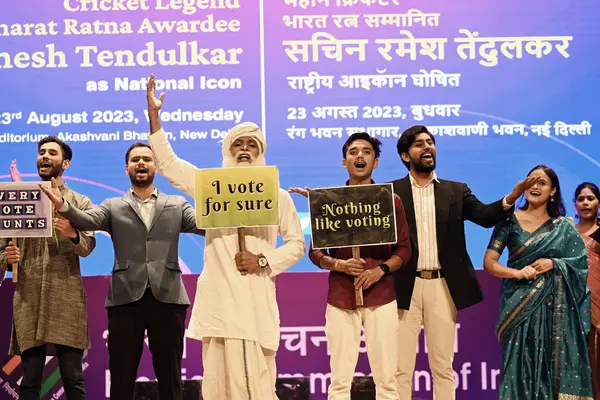 stock image NEW DELHI INDIA AUGUST 23 2023 National School of Drama NSD students perform at a programme where cricket legend Sachin Tendulkar was recognised as National Icon of the Election Commission EC to encourage higher voter turnout at Akashwani Bhawan on A