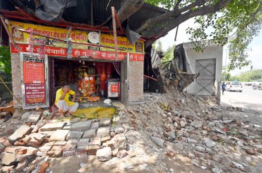 NEW DELHI INDIA AUGUST 20 2023 PWD demolished encroachments outside Peepleshwar Temple during an anti encroachment drive at Jhandewalan on August 20 2023 in New Delhi India The demolition was carried out in the presence of a large number of police an clipart