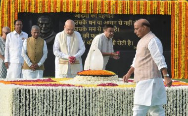 NEW DELHI INDIA AUGUST 16 2023 Union Home Minister Amit Shah and Union Defence Minister Rajnath Singh pay tribute to former Prime Minister Atal Bihari Vajpayee on his death anniversary at his memorial Sadaiv Atal on August 16 2023 in New Delhi India  clipart