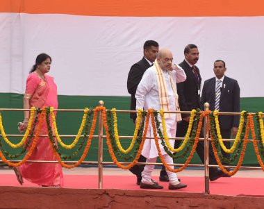 NEW DELHI INDIA AUGUST 15 2023 Minister of Home Affairs of India Amit Shah along his wife Sonal Shah arrive at the rampart during the 77th Independence Day function at the historic Red Fort on August 15 2023 in New Delhi India Narendra Modi said that clipart