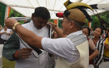 NEW DELHI INDIA AUGUST 14 2023 Minister of Tribal Affairs Arjun Munda interact with a Tribal during the 200 Sarpanches from Border Villages of Himachal Pradesh Uttarakhand Sikkim and Arunachal Pradesh besides UT of Ladakh which are under Vibrant Vill clipart