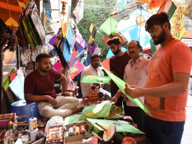 NEW DELHI INDIA AUGUST 14 2023 People buy kites and manjha on the Eve of 77th Independence Day celebration at Gandhi nagar on August 14 2023 in New Delhi India Photo by Sonu Mehta Hindustan Times  clipart