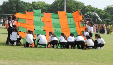 GURUGRAM INDIA AUGUST 13 2023 Students of Dev Samaj Vidya Niketan Vidyalaya perform the dance on the theme of Jai Ho and Chak De India during the full dress rehearsal for the upcoming 77th Independence Day parade at Tau Devi Lal Stadium in Sector 38  clipart