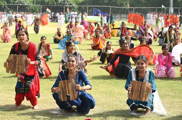 stock image GURUGRAM INDIA AUGUST 13 2023 Students of Government Girls Senior Secondary School Jacobpura performed the cultural program based on Punjabi Bhangra and Gidda during the full dress rehearsal for the upcoming 77th Independence Day parade at Tau Devi L