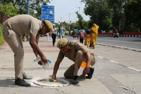 stock image NEW DELHI INDIA AUGUST 12 2023 Delhi Police marking on manholes for security near Red Fort ahead of Independence Day celebration on August 12 2023 in New Delhi India Photo by Salman Ali Hindustan Times