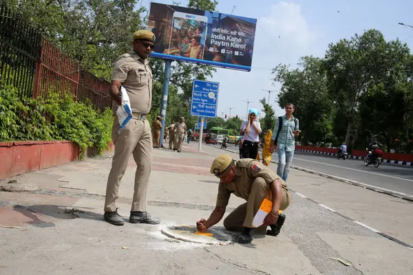 stock image NEW DELHI INDIA AUGUST 12 2023 Delhi Police marking on manholes for security near Red Fort ahead of Independence Day celebration on August 12 2023 in New Delhi India Photo by Salman Ali Hindustan Times