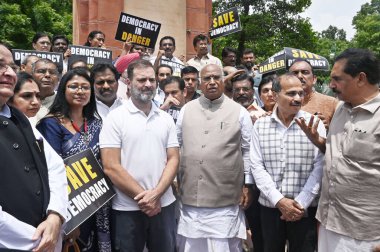 NEW DELHI INDIA AUGUST 11 2023 Leader of Opposition in Rajya Sabha & Congress President Mallikarjun Kharge with party leader Rahul Gandhi Leader of Opposition in Lok Sabha Adhir Ranjan Chowdhury and others during a protest of opposition MPs at Parlia clipart