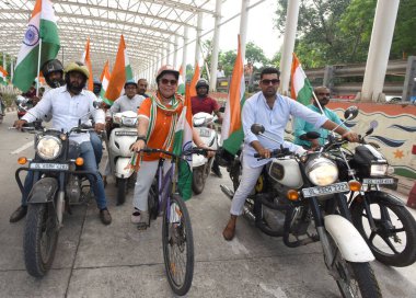 NEW DELHI INDIA AUGUST 11 2023 Minister of State for External Affairs and Culture Meenakshi Lekhi participate Har Ghar Tiranga Bike rally of MPs at Pragati Maidan clipart