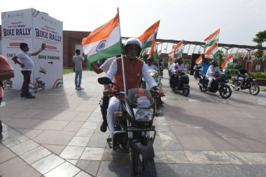 NEW DELHI INDIA AUGUST 11 2023 Minister of State of Power and Heavy Industries Krishan Pal Gurjar participate Har Ghar Tiranga Bike rally of MPs at Pragati Maidan clipart