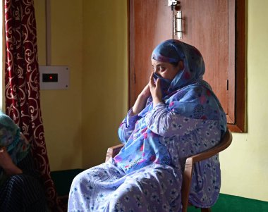 SRINAGAR INDIA AUGUST 5 2023 Wife of an Army soldier Waseem Ahmad Bhat who was killed in an encounter mourn at her residence in Bandipora north of Srinagar on August 5 2023 in Srinagar India Bhat was among three Army soldiers killed in an encounter w clipart