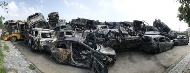 GURUGRAM INDIA AUGUST 1 2023 Vehicles damaged in Nuh clash parked at Nuh bus stand at least 50 vehicles were torched after a massive communal violence in Nuh on August 1 2023 in Nuh India Five people were killed and over 50 people including policemen clipart