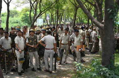 GURUGRAM INDIA AUGUST 1 2023 Police personnel conduct a flag march due to security reasons at Nuh near Bus Stand on August 1 2023 in Nuh India Five people were killed and over 50 people including policemen were injured in Haryana after clashes broke  clipart