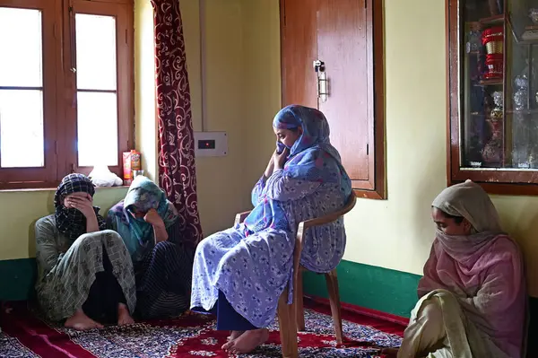 stock image SRINAGAR INDIA AUGUST 5 2023 Wife of an Army soldier Waseem Ahmad Bhat who was killed in an encounter mourn at her residence in Bandipora north of Srinagar on August 5 2023 in Srinagar India Bhat was among three Army soldiers killed in an encounter w