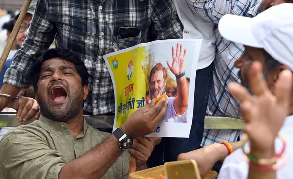 stock image NEW DELHI INDIA AUGUST 4 2023 Congress workers raise slogans in support of party leader Rahul Gandhi to celebrate after the Supreme Court stayed the conviction of Gandhi in the 2019 criminal defamation case over his Modi surname remark restoring his 