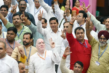 NEW DELHI INDIA SEPTEMBER 27 2024 BJP candidate Sunder Singh Tanwar with other party councillors shows victory sign after the MCD Standing Committee member election at MCD House in New Delhi Friday Sept 27 2024 BJP won the last vacant seat of the MCD clipart