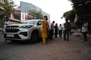 NEW DELHI INDIA SEPTEMBER 30 2024 Delhi Chief Minister Atishi inspecting potholes on road the bad condition of road near NSIC Kalka Ji road along with PWD officials on September 30 2024 in New Delhi India Chief Minister inspected and identified damag clipart