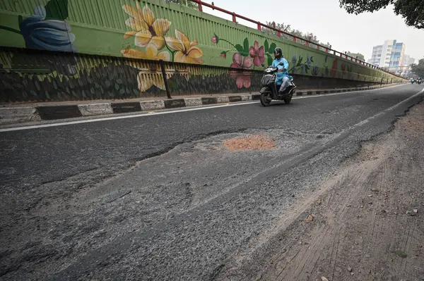 stock image NEW DELHI INDIA SEPTEMBER 30 2024 Potholes seen over road near NSIC Complex as Atishi Chief Minister of Delhi seen along with PWD officials inspects the condition of Outer Ring Road at Kalkaji on September 30 2024 in New Delhi India Chief Minister in