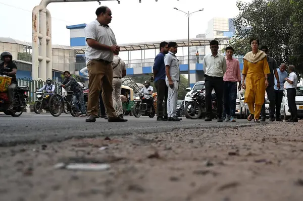 stock image NEW DELHI INDIA SEPTEMBER 30 2024 Delhi Chief Minister Atishi inspecting potholes on road the bad condition of road near NSIC Kalka Ji road along with PWD officials on September 30 2024 in New Delhi India Chief Minister inspected and identified damag