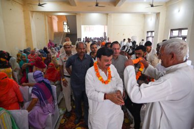 GURUGRAM INDIA OCTOBER 1 2024 Rao Narbir Singh Bharatiya Janata Party candidate from Badshahpur seat for Haryana Assembly Election addresses a public meeting during the election campaign at Garauli Kalan village near Shri Hanumaan Mandir on October 1 clipart