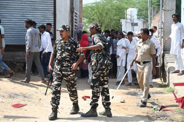 GURUGRAM INDIA OCTOBER 5 2024 Commandos of Sashastra Seema Bal SSB take action after a clash broke out between two groups during the voting for Haryana Assembly Election in Gulalta village of Punahana district Mewat on October 5 2024 in Gurugram Indi clipart