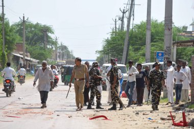 GURUGRAM INDIA OCTOBER 5 2024 Commandos of Sashastra Seema Bal SSB take action after a clash broke out between two groups during the voting for Haryana Assembly Election in Gulalta village of Punahana district Mewat on October 5 2024 in Gurugram Indi clipart