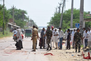 GURUGRAM INDIA OCTOBER 5 2024 Commandos of Sashastra Seema Bal SSB take action after a clash broke out between two groups during the voting for Haryana Assembly Election in Gulalta village of Punahana district Mewat on October 5 2024 in Gurugram Indi clipart