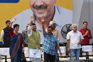 NEW DELHI INDIA OCTOBER 6 2024 AAP leader and Delhi former Chief Minister Arvind Kejriwal Delhi CM Atishi along with party leaders during the public meeting Janta Ki Adalat to engage with the people at Chhatrasal Stadium on October 6 2024 in New Delh clipart