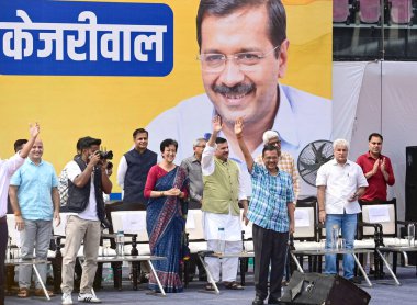 NEW DELHI INDIA OCTOBER 6 2024 Delhi CM Atishi with AAP National Convener Arvind Kejriwal and Party leaders during the public meeting Janta Ki Adalat to engage with the people at Chhatrasal Stadium on October 6 2024 in New Delhi India Kejriwal Sunday clipart