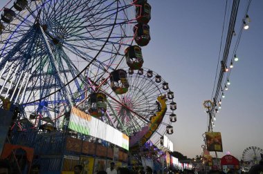 NEW DELHI INDIA OCTOBER 10 2024 People Enjoy a ferris wheel on the of the Ramlila festival Fair at Ramlila Ground on October 10 2024 in New Delhi India Photo by Raj K Raj Hindustan Times clipart