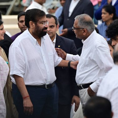 MUMBAI INDIA OCTOBER 10 2024 Harsh Goenka interacts with Natarajan Chandrasekaran to pay tribute to mortal remains of Ratan Tata during funeral at NCPA on October 10 2024 in Mumbai India Ratan Tata took over at Tata Group's helm in 1991 is credited w clipart