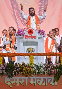 MUMBAI INDIA OCTOBER 12 2024 Maharashtra Chief Minister Eknath Shinde addressing the gathering during the Dussehra rally held at Azad Maidan on October 12 2024 in Mumbai India Eknath Shinde launched a scathing attack on Shiv Sena UBT chief Uddhav Tha clipart