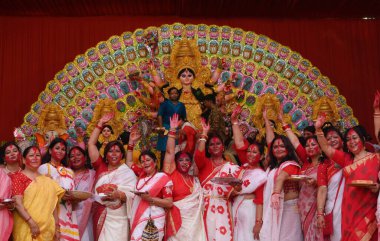  LUCKNOW INDIA OCTOBER 13 2024 Women apply sindoor on each others faces during Sindoor Khela on the final day of the Durga Puja on the occasion of Vijayadashami at Patrakar Puram on October 13 2024 in Lucknow India Photo by Deepak Gupta Hindustan Tim clipart