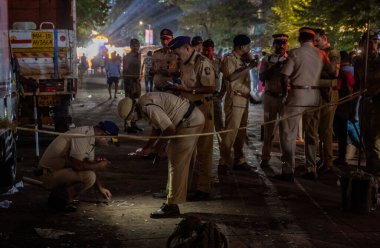 MUMBAI INDIA OCTOBER 12 2024 Police investigating the spot after firing at NCP leader Baba Siddique in Nirmal nagar Bandra east on October 12 2024 in Mumbai India Two persons were arrested immediately after the incident that took place outside his ML clipart