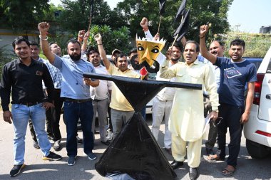 NEW DELHI INDIA OCTOBER 15 2024 Members from Delhi Taxi Tourists Transporters and Tour operators Association protests against the Delhi Transport Department for their various demands at Mata Sundari College on October 15 2024 in New Delhi India Photo clipart