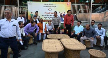 NEW DELHI INDIA OCTOBER 15 2024 DRM Sukhwinder Singh with other railway officers and passengers participate in Swachhta Hi Seva campaign during Railway Chopal in Delhi Division Northern Railway at New Delhi Railway Station Ajmeri Gate side on October clipart