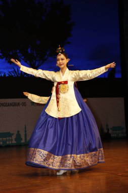 NEW DELHI INDIA MAY 23 2023 Students of Daekyung University perform a traditional folk dance with meditative movements during the Indo Korean culture and camaraderie at Kamani Auditorium Mandi House on May 23 2023 in New Delhi India Dressed in colorf clipart