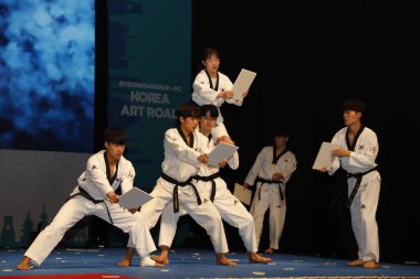 NEW DELHI INDIA MAY 23 2023 Students of Daekyung University s Taekwondo Department perform during the Indo Korean culture and camaraderie at Kamani Auditorium Mandi House on May 23 2023 in New Delhi India Dressed in colorful attires Korean and Indian clipart