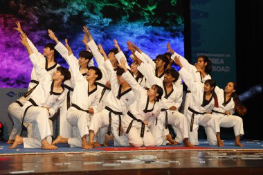 NEW DELHI INDIA MAY 23 2023 Students of Daekyung University s Taekwondo Department perform during the Indo Korean culture and camaraderie at Kamani Auditorium Mandi House on May 23 2023 in New Delhi India Dressed in colorful attires Korean and Indian clipart