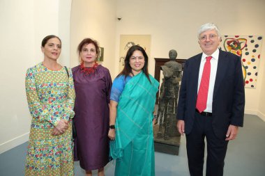 NEW DELHI INDIA MAY 23 2023 Meenakshi Lekhi 2R Minister of State for External Affairs and Culture Italian ambassador to India Vincenzo De Luca R with his wife Paola Ferri 3R during the opening of an Italian art exhibition titled The Grand Italian Vis clipart