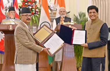 NEW DELHI INDIA JUNE 1 2023 Prime Minister Narendra Modi and Prime Minister of Nepal Pushpa Kamal Dahal Prachanda look on as Union Commerce Minister Piyush Goyal exchanges documents of MoU with his Nepalese counterpart during their joint press statem clipart